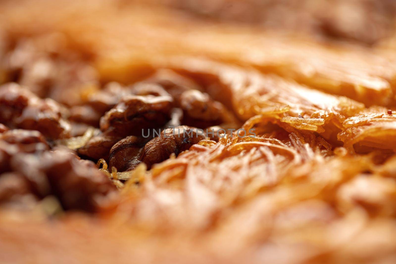 Close up photo of Turkish Baklava dessert with honey and nuts