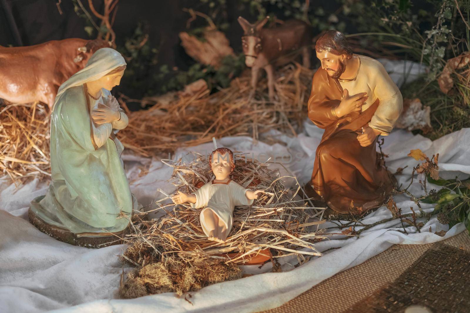Christmas creche with Joseph Mary and small Jesus in a crib
