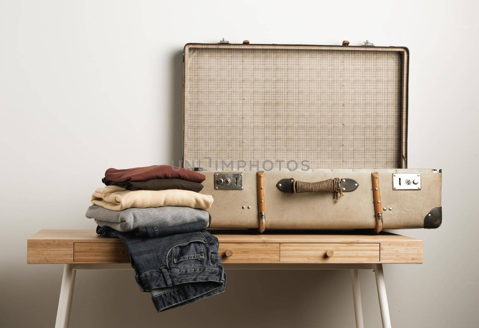 close up vintage suitcase with casual clothes by Zahard