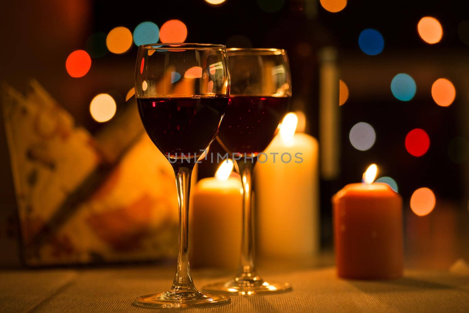 Romantic dinner in restaurant with candles and wine