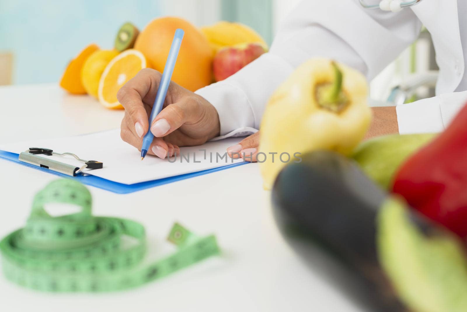 close up nutritionist writing prescription