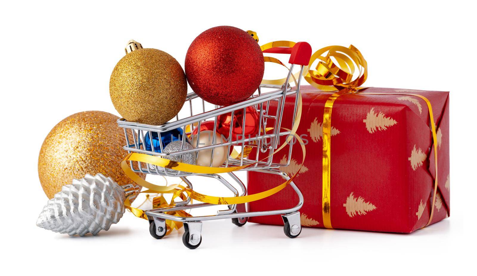 Shopping cart with Christmas decorations isolated on white background, close up