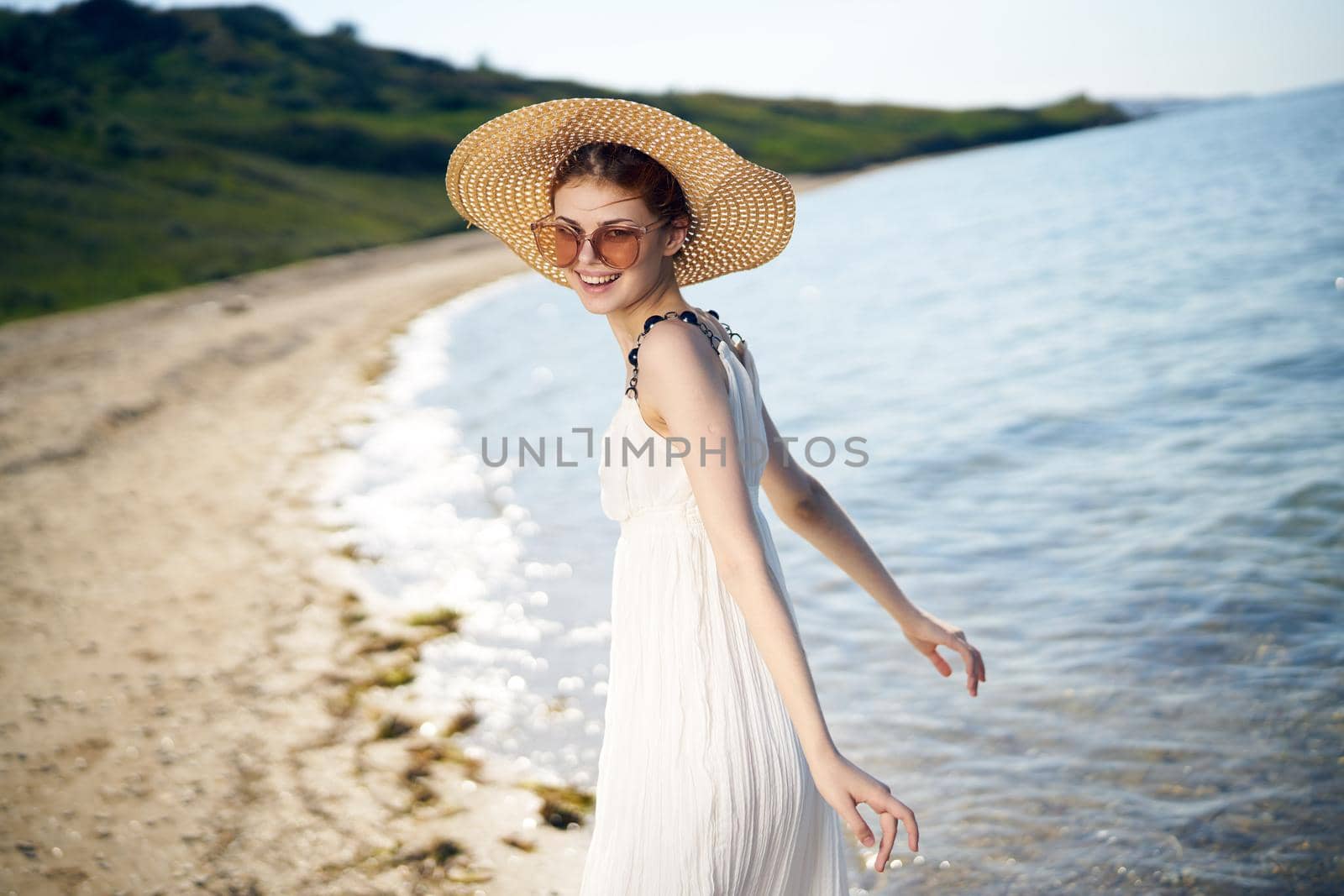 pretty woman with hat on island beach ocean summer fun. High quality photo