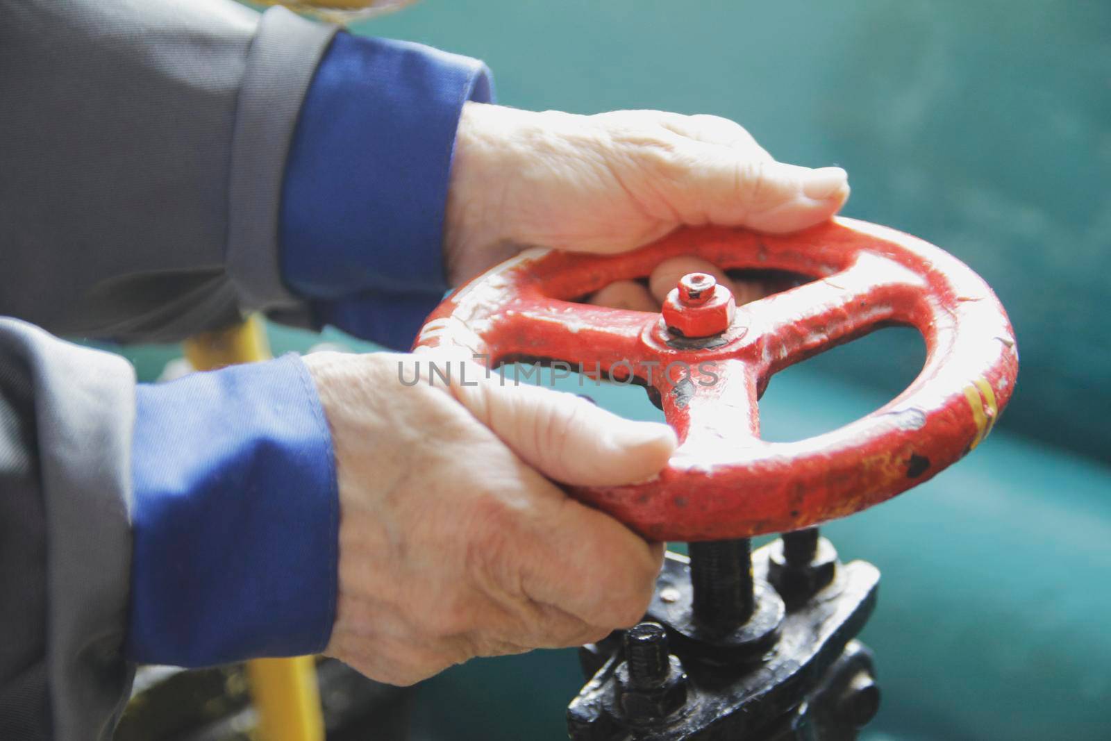 Hand of technician worker open the valve - close up shot