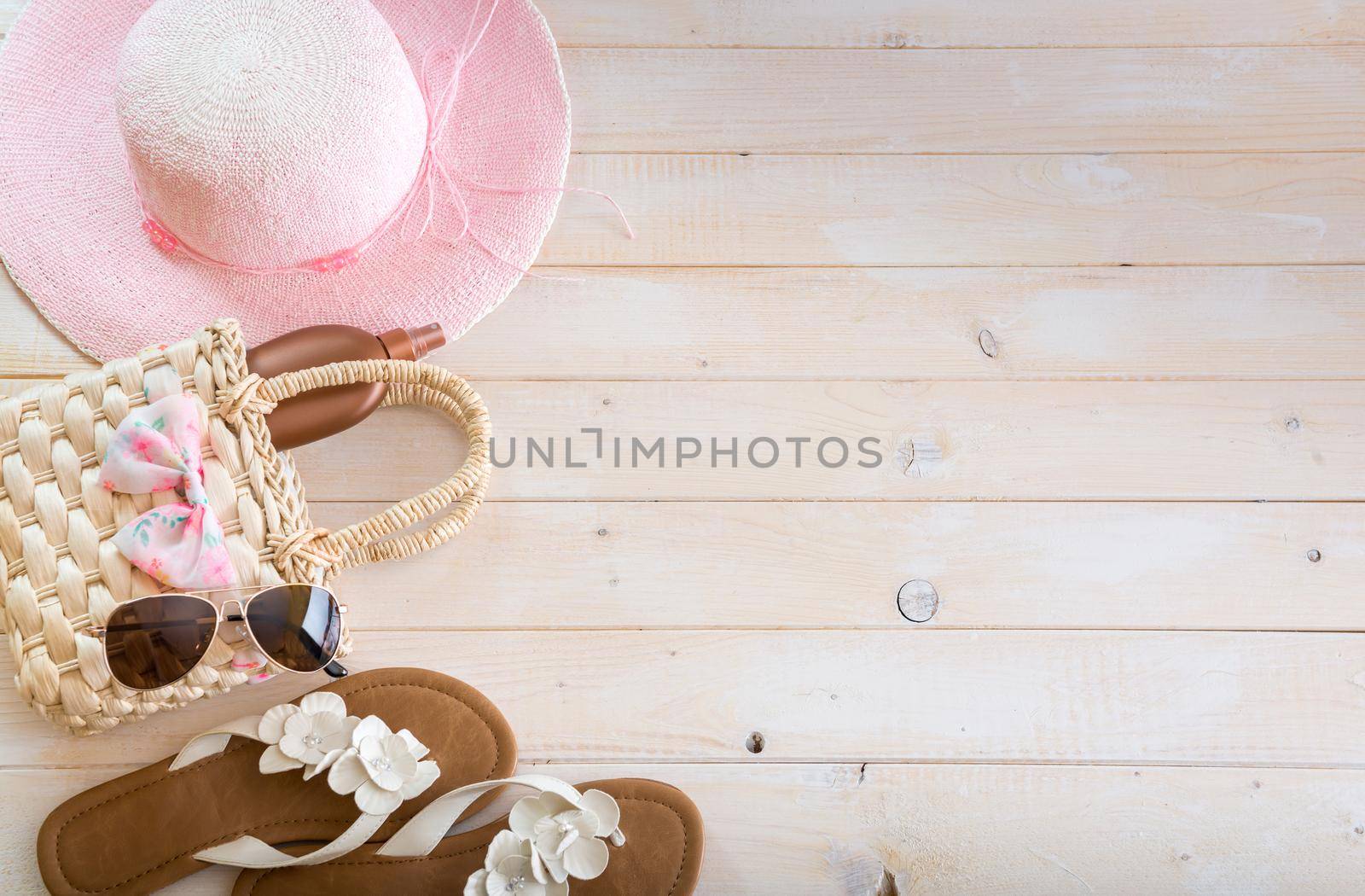 beach accessories on a white wooden background