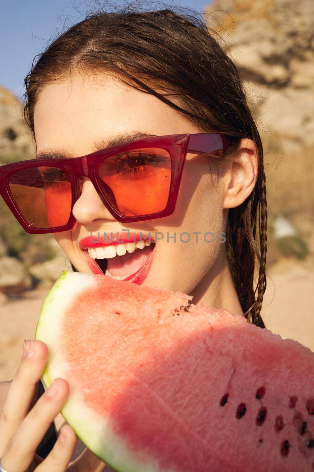 woman eating watermelon outdoors Sun summer close-up. High quality photo