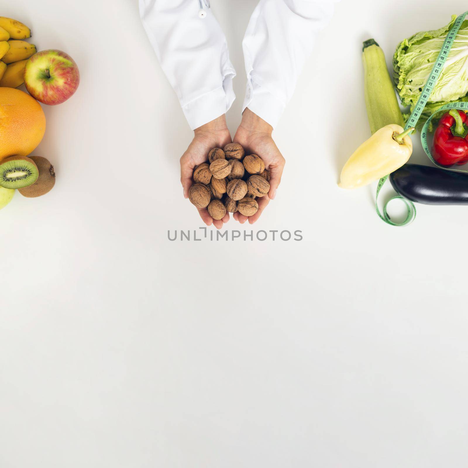 close up person with vegetables holding nuts by Zahard