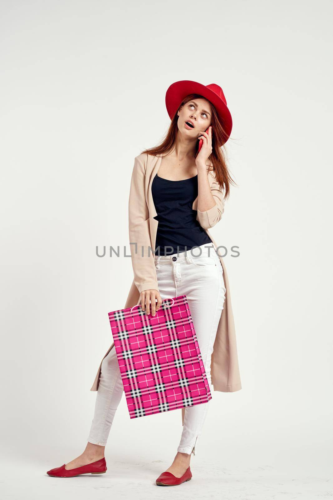 beautiful woman wearing a red hat posing shopping fun isolated background by Vichizh