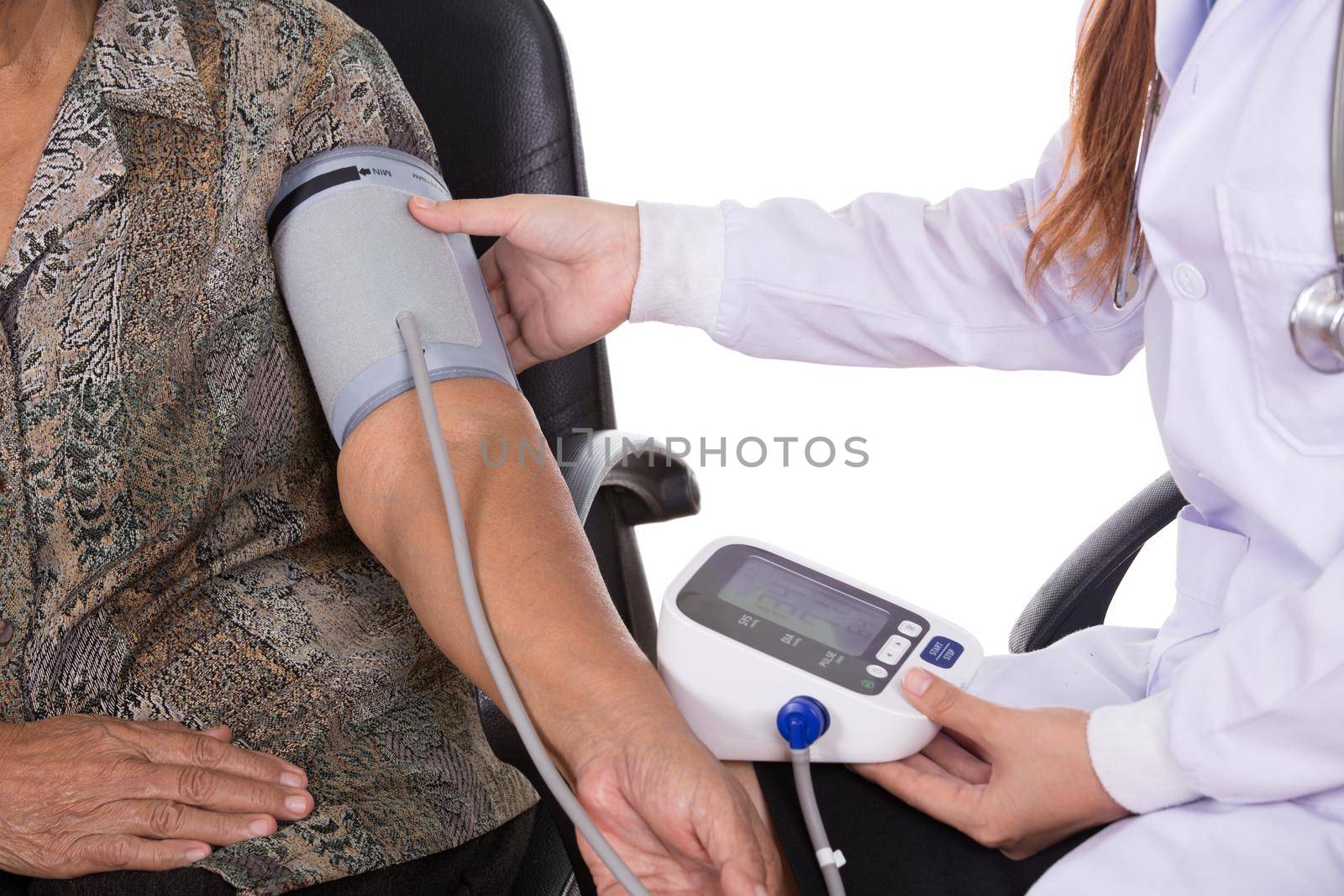close-up of Female doctor measuring blood pressure of senior woman