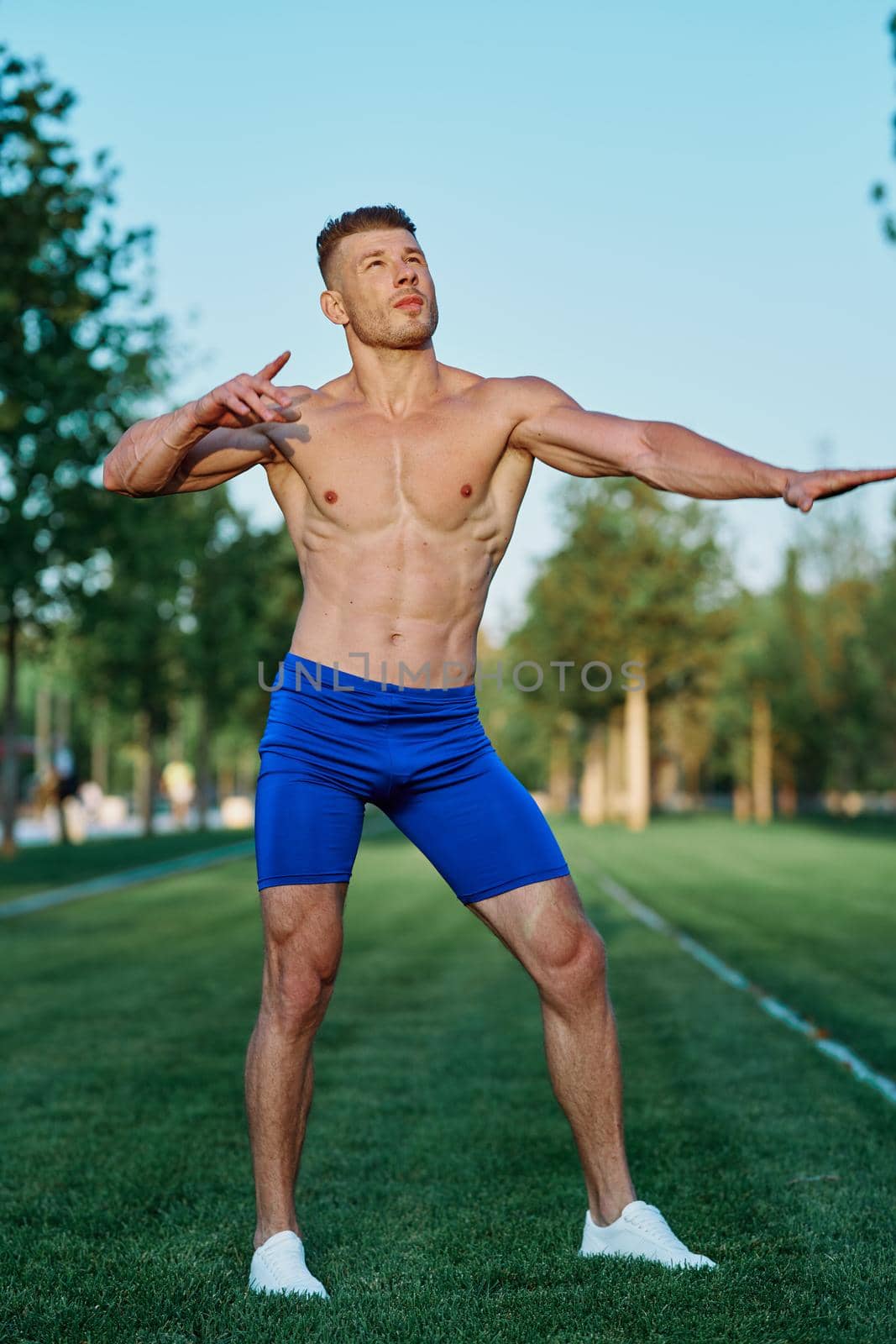 man doing exercises in the park inflated body. High quality photo