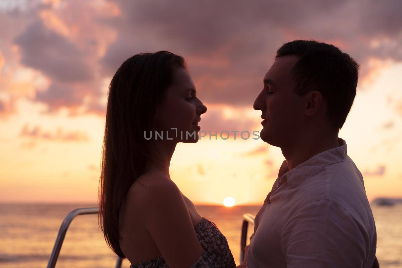 Romantic sensual young couple in love at the sunset by Fabrikasimf