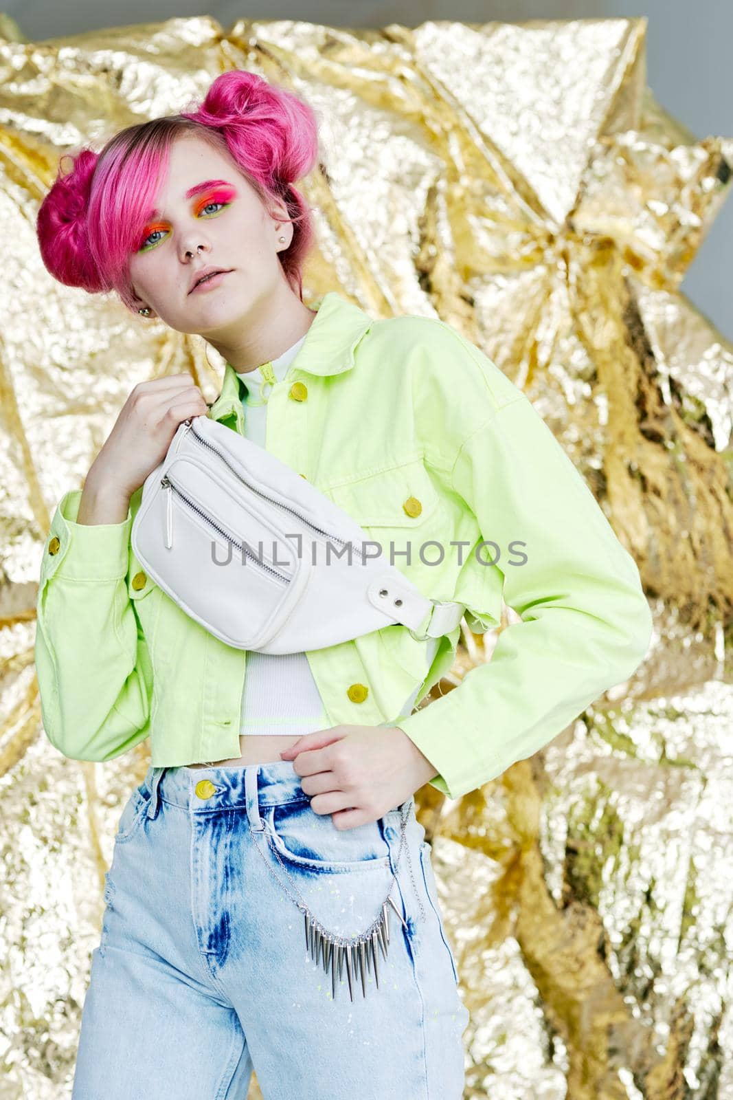 cheerful woman with pink hair in dress posing cosmetics. High quality photo