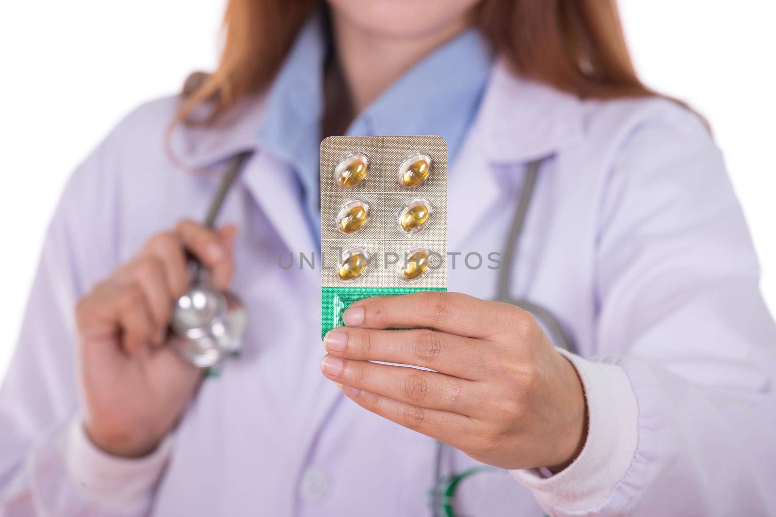 close up pills with female doctor isolated on white background