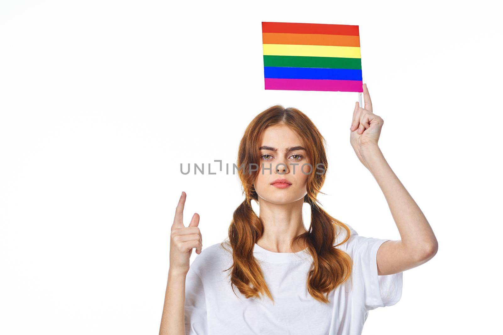 woman with lgbt flag transgender community light background. High quality photo