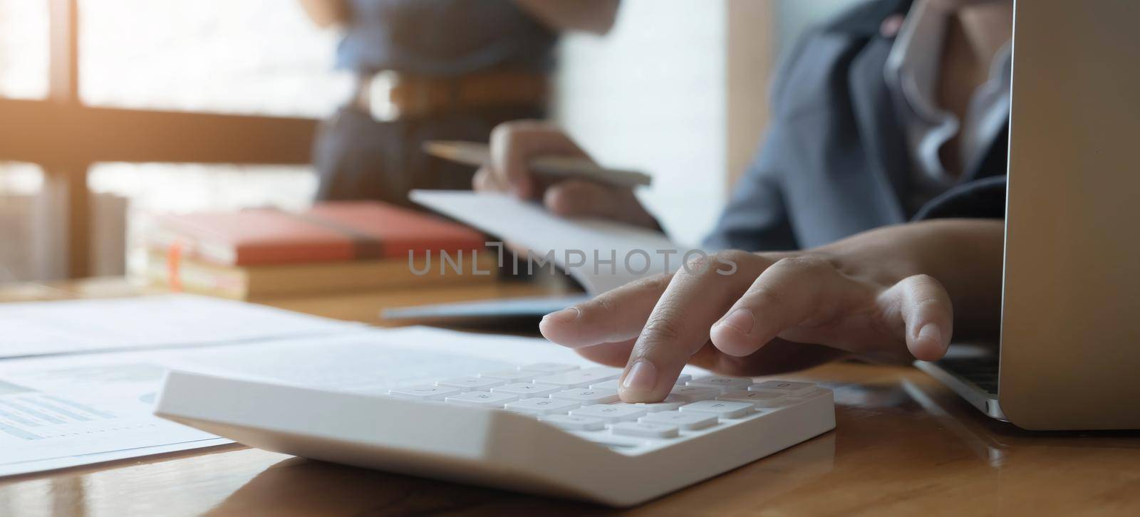 Close up view of bookkeeper or financial inspector hands making report, calculating or checking balance. Home finances, investment, economy, saving money or insurance concept.