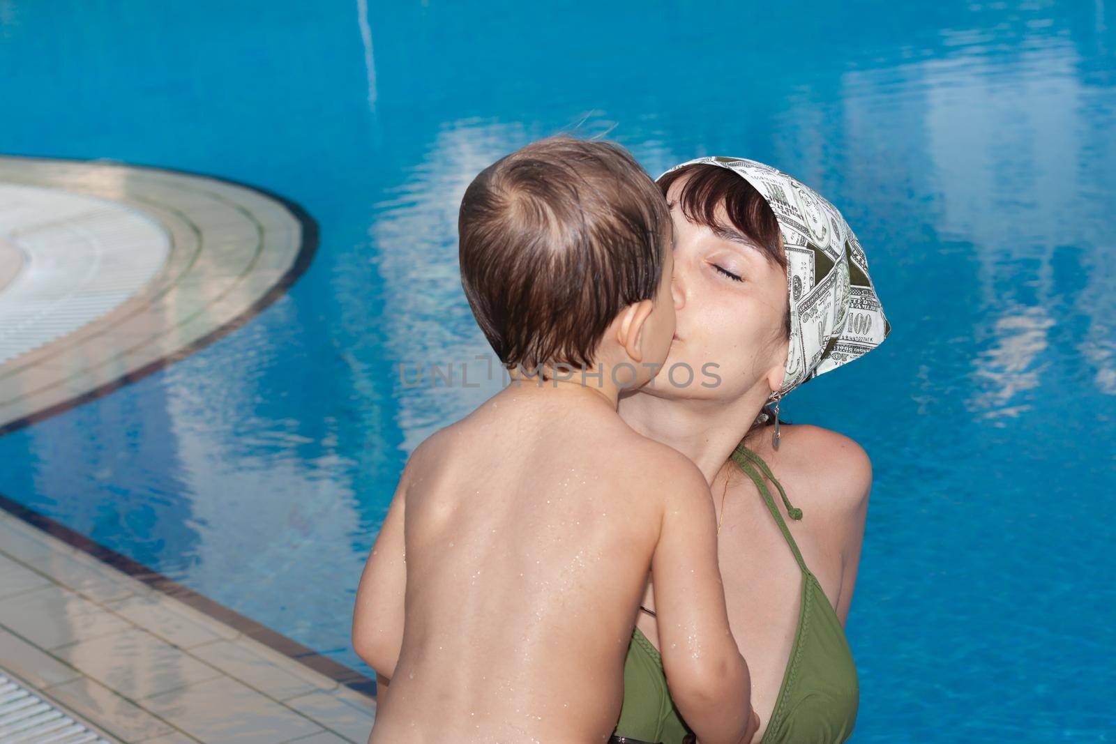 mother with small child near the pool  by palinchak
