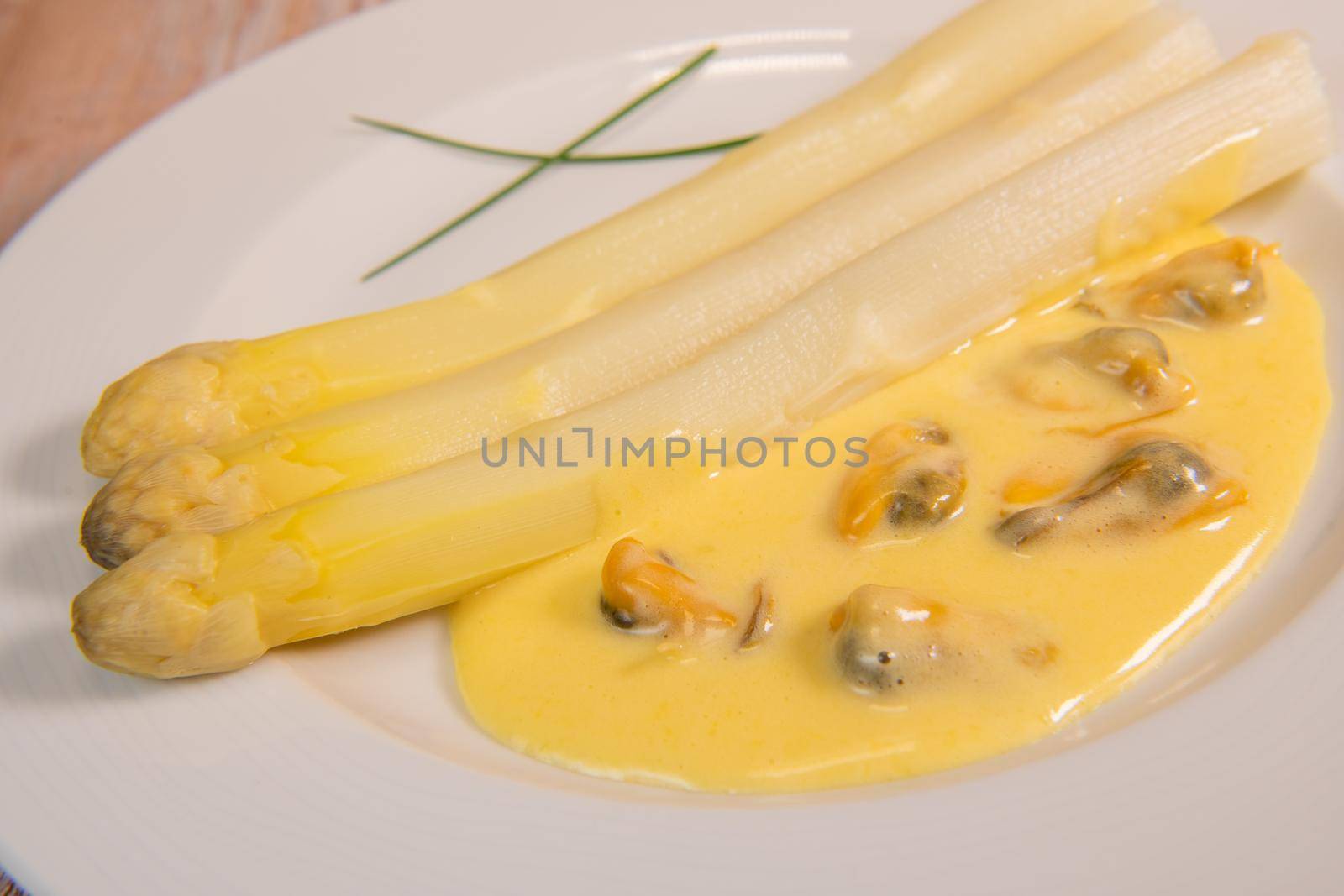 Large white asparagus and shell mousseline recipe. High quality photo
