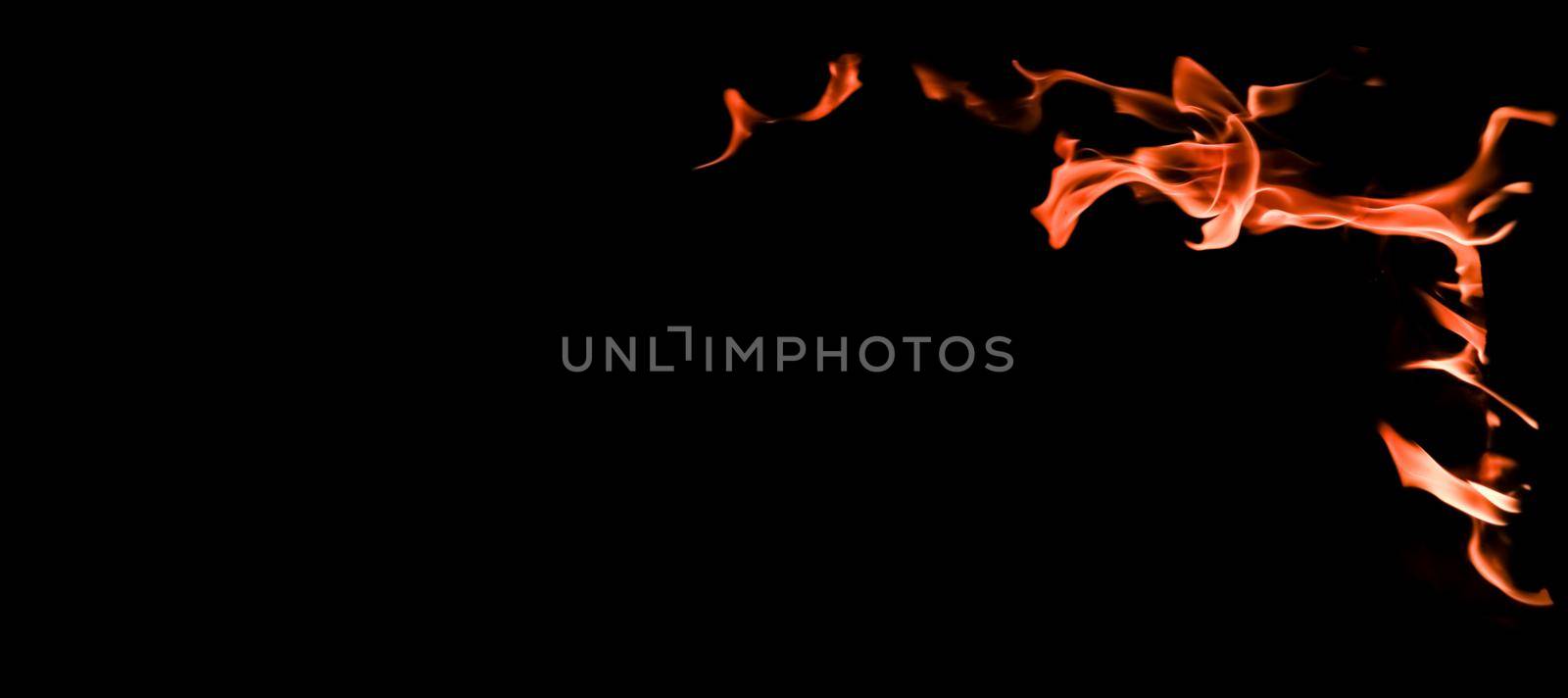 Flames of fire on a black background. The mystery of fire.