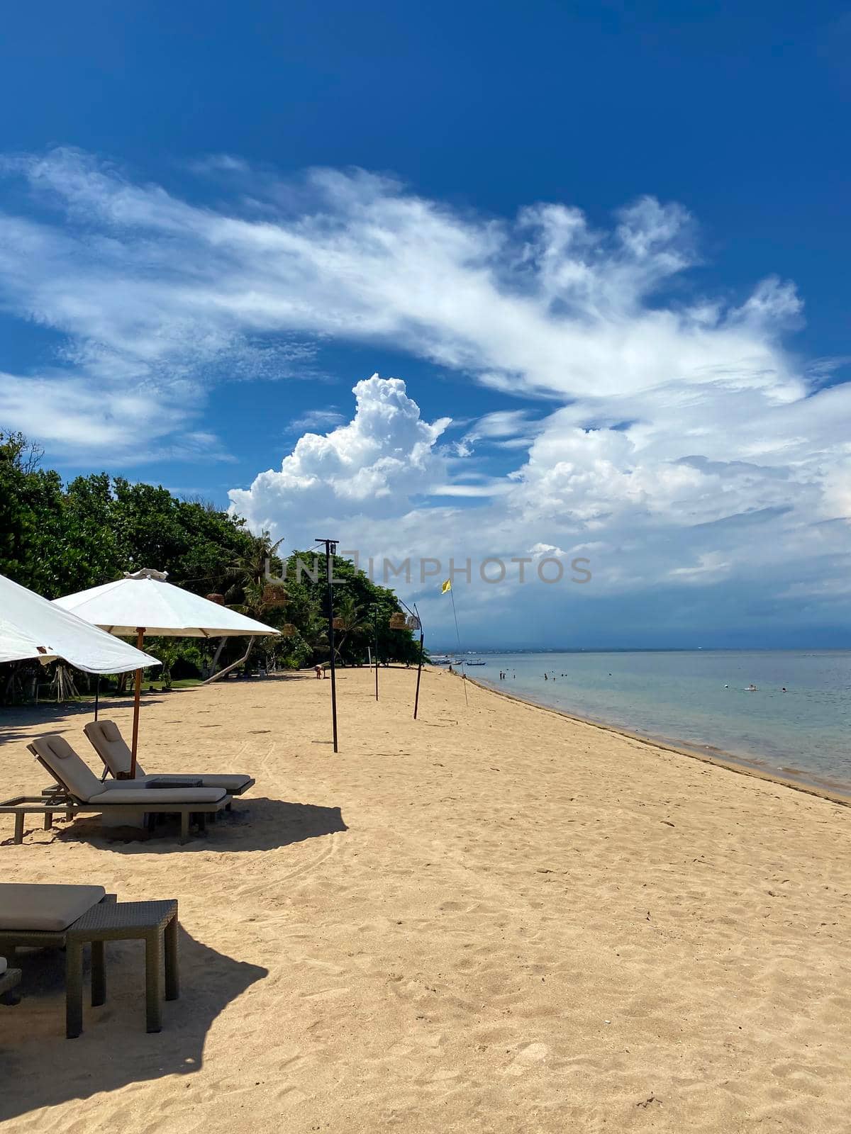 Stunning beautiful beach with relaxing scenery on a beach. Famous travel destination in Sanur, Bali, Indonesia. - stock photo. High quality photo