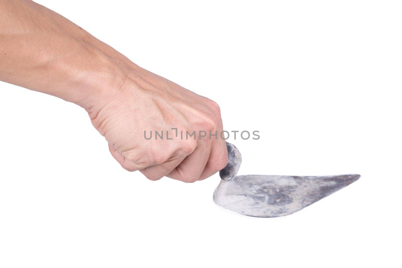 Old trowel in hand isolated on white background