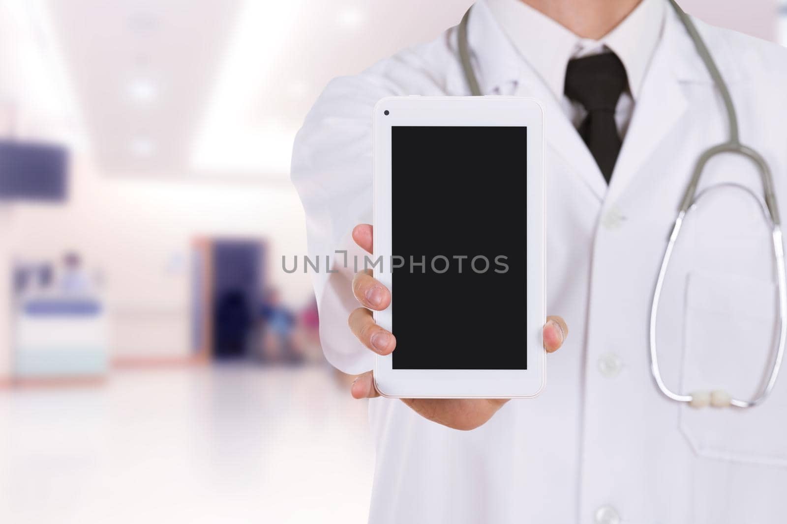 doctor showing tablet computer blank screen in hospital by geargodz