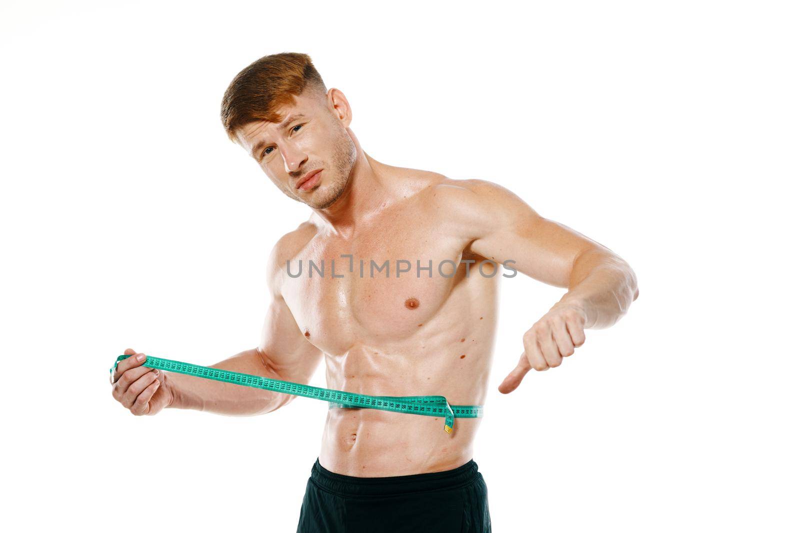 athletic man with measuring tape muscle workout by Vichizh
