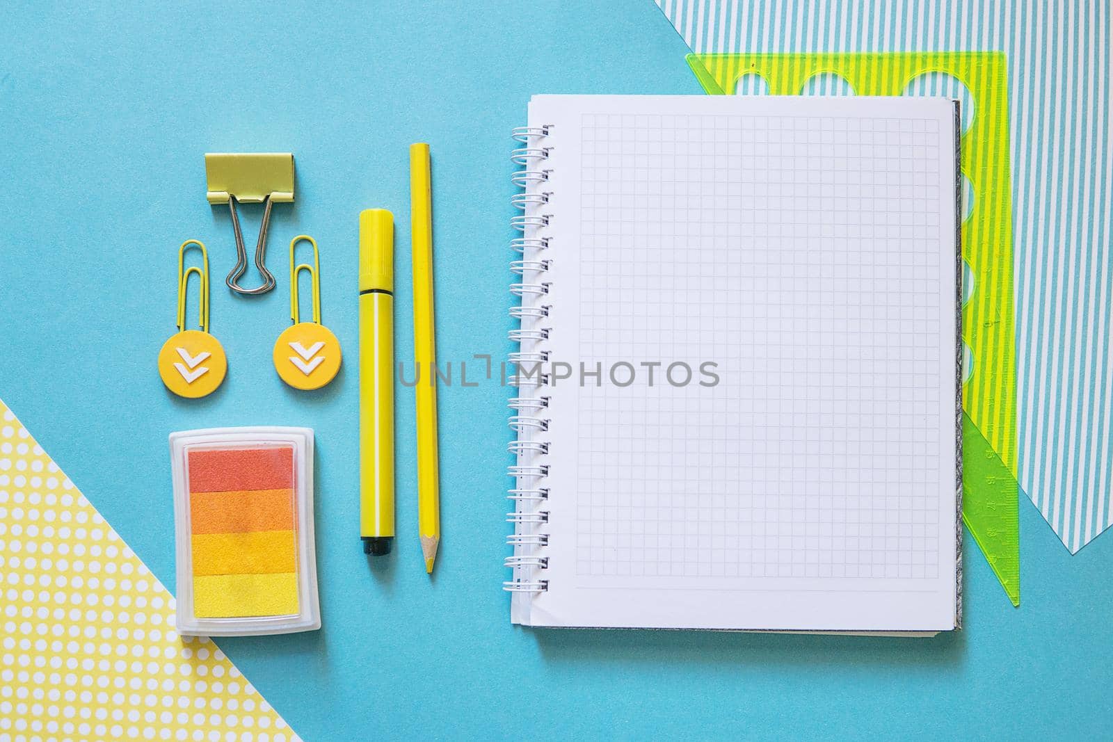 School supplies. Yellow and blue colors. Empty notebook. Flat lay composition. Space for text. Back to school.