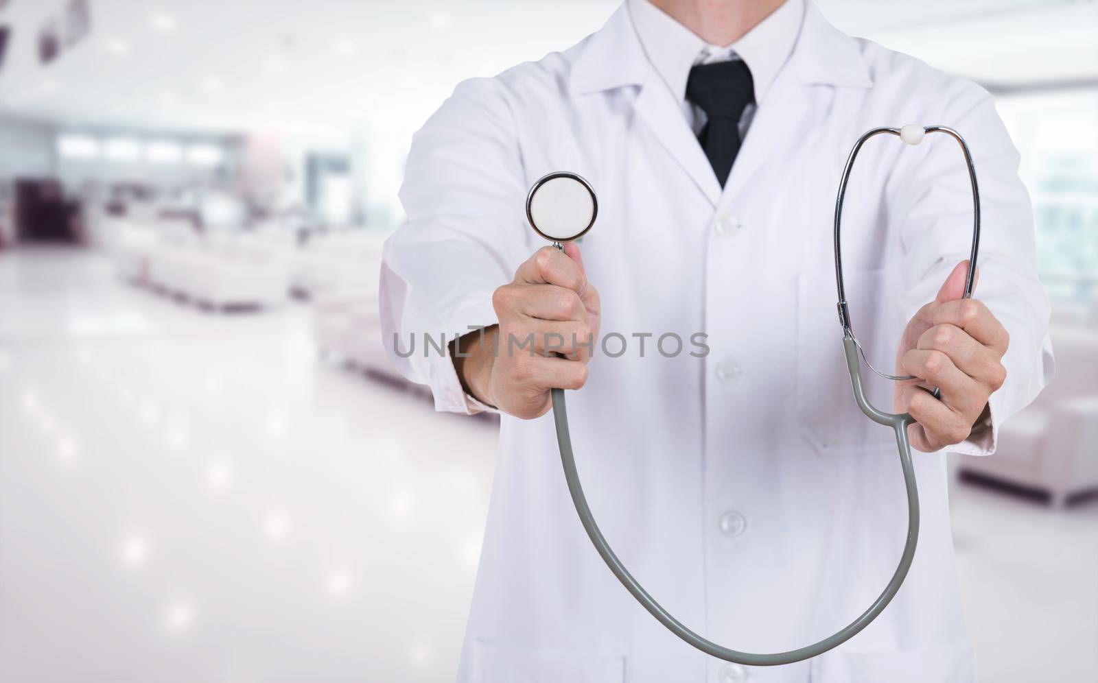 doctor with stethoscope in hospital background