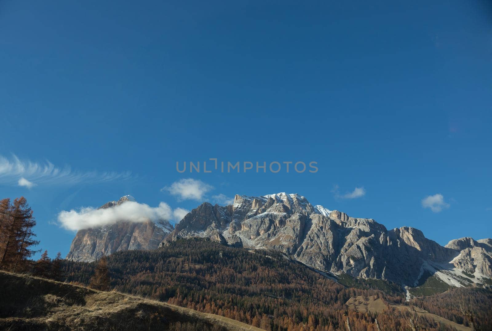 Dolomites nature. A view on mountains and blue sky. Mid shot