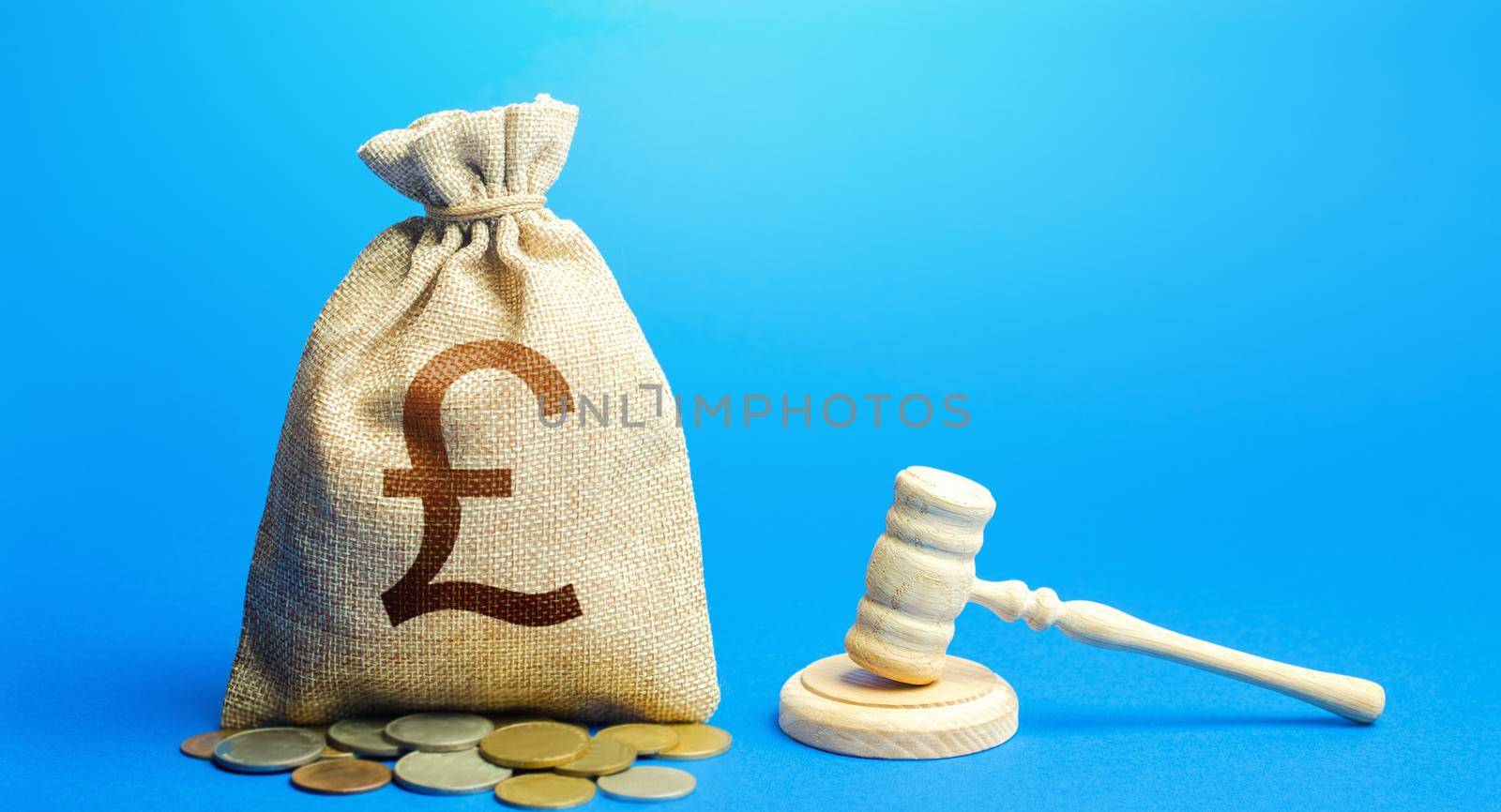 British pound sterling money bag and judge's gavel. Litigation, dispute resolution, conflict of interest settlement. Awarding moral financial compensation. Protection rights. Justice. Lawyer services. by iLixe48
