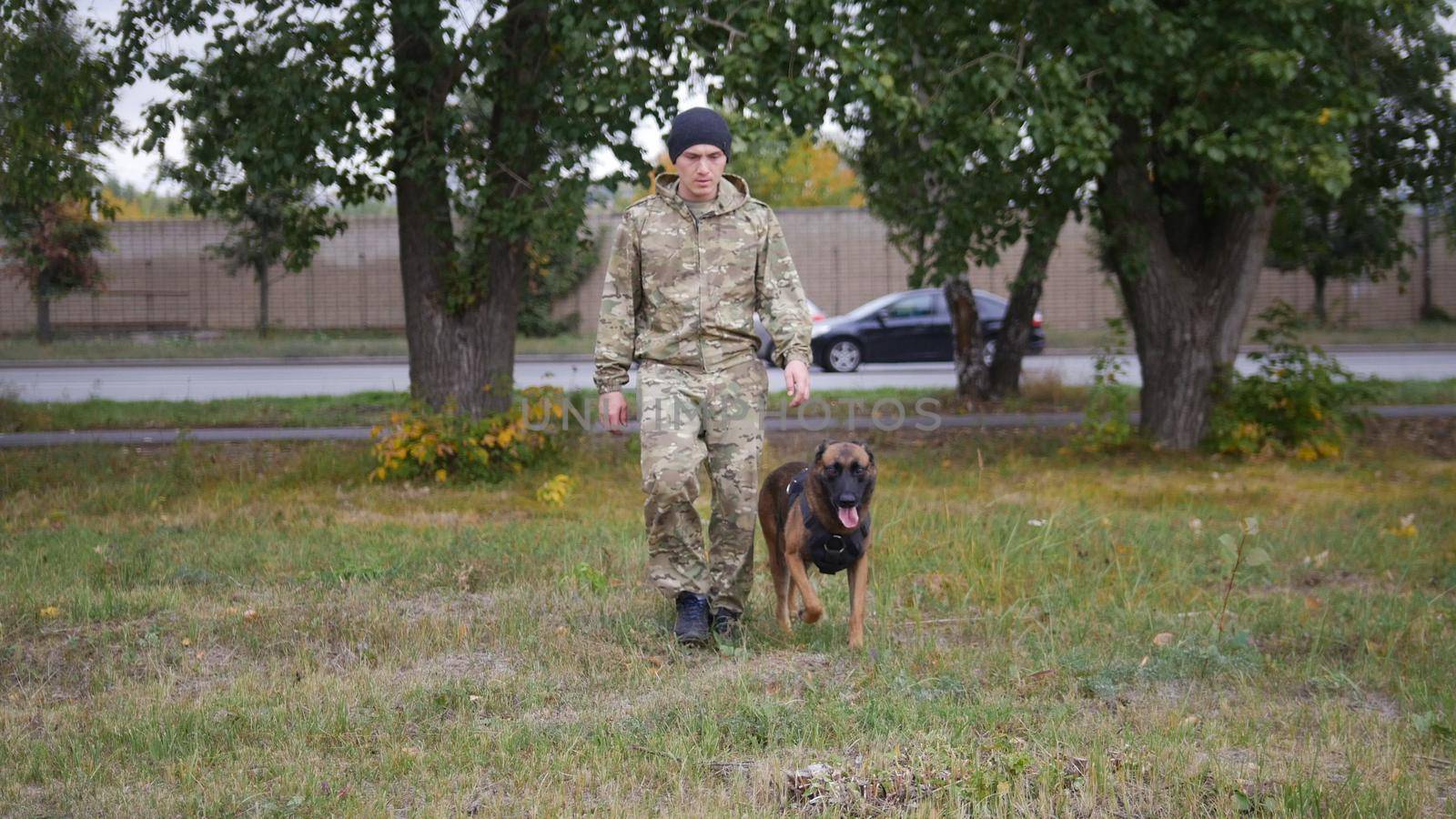 A trainer and his german shepherd dog by Studia72