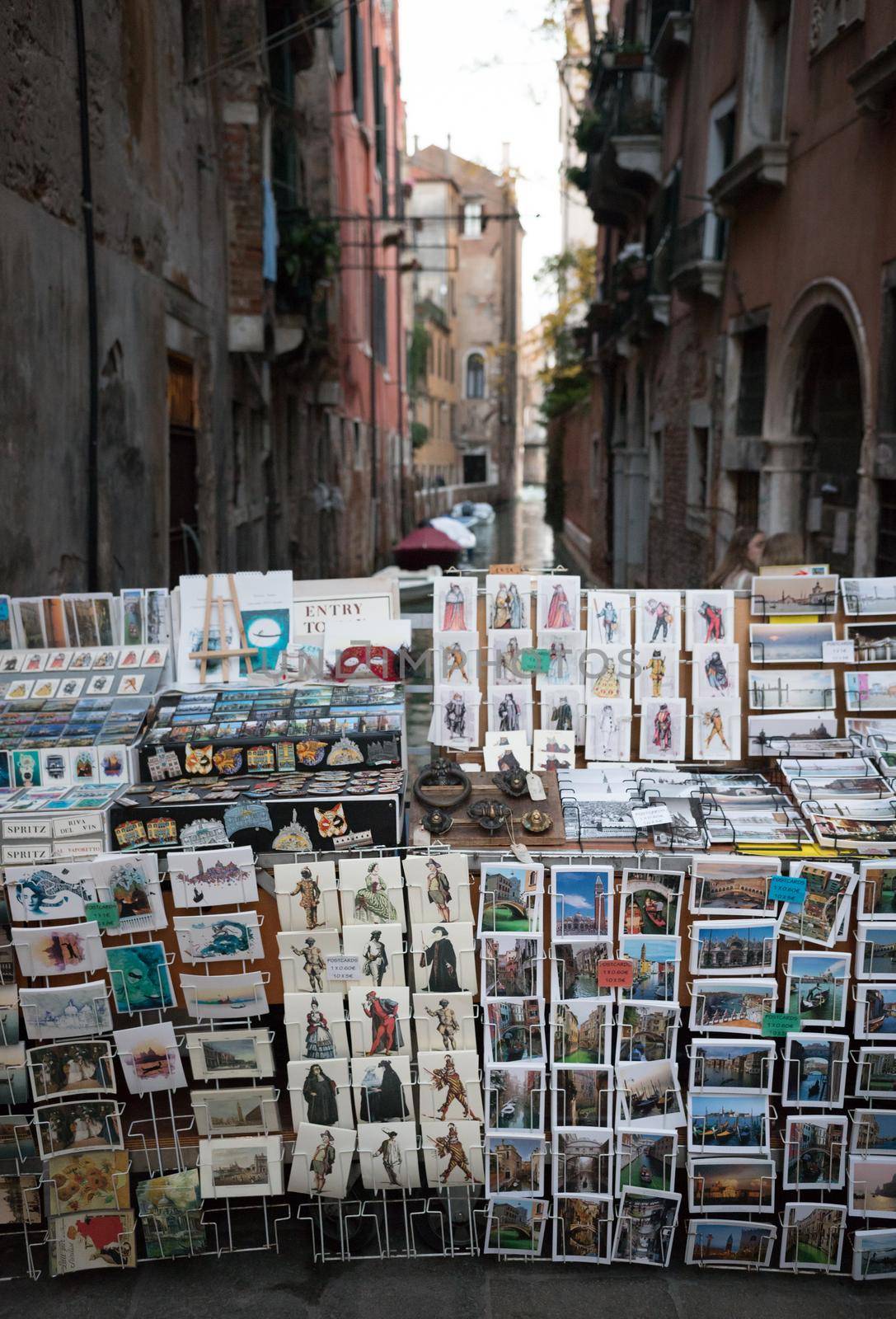 Selling postcards on the streets on Venice. Vertical shot
