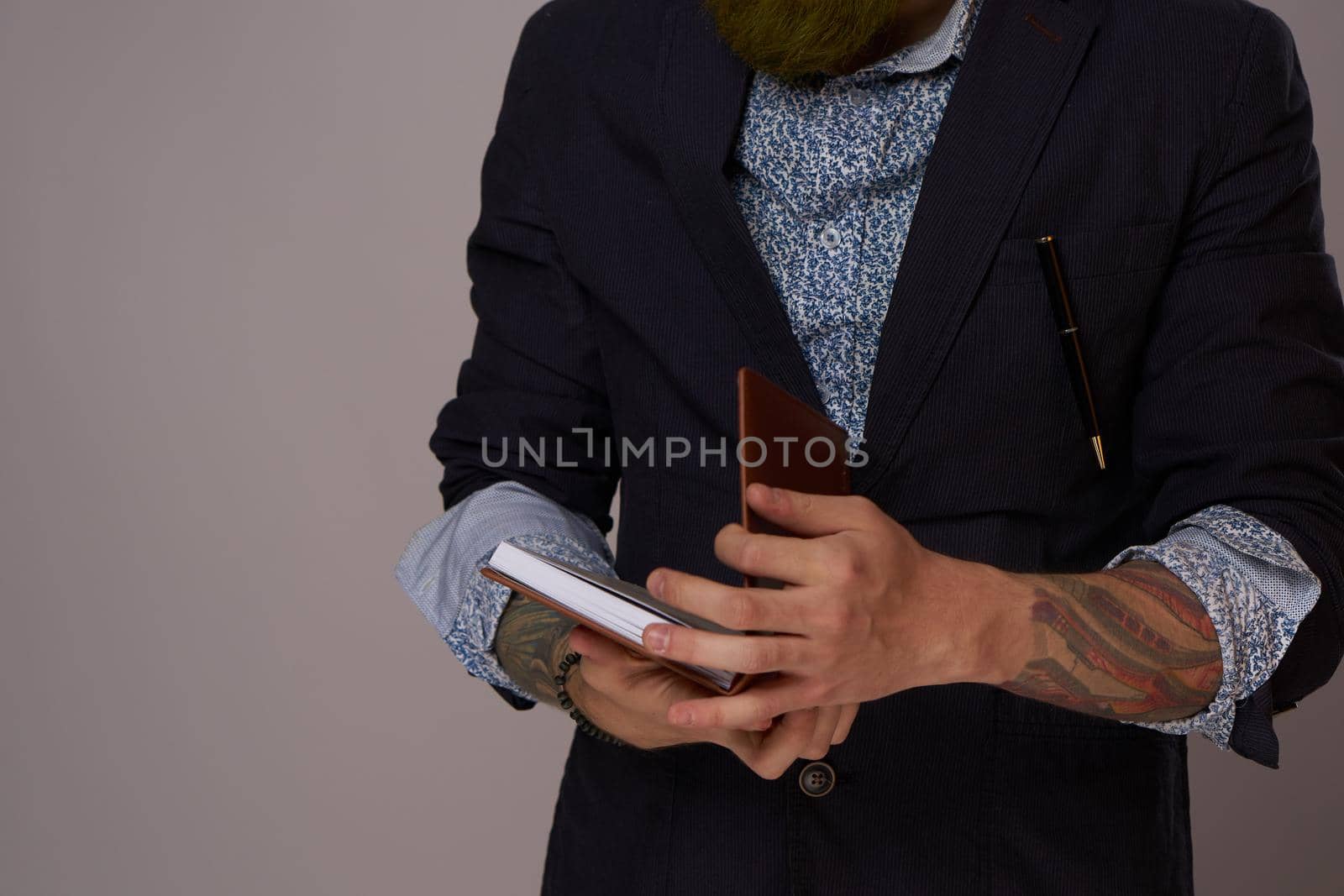 portrait of a business man wearing glasses with a beard posing an official. High quality photo