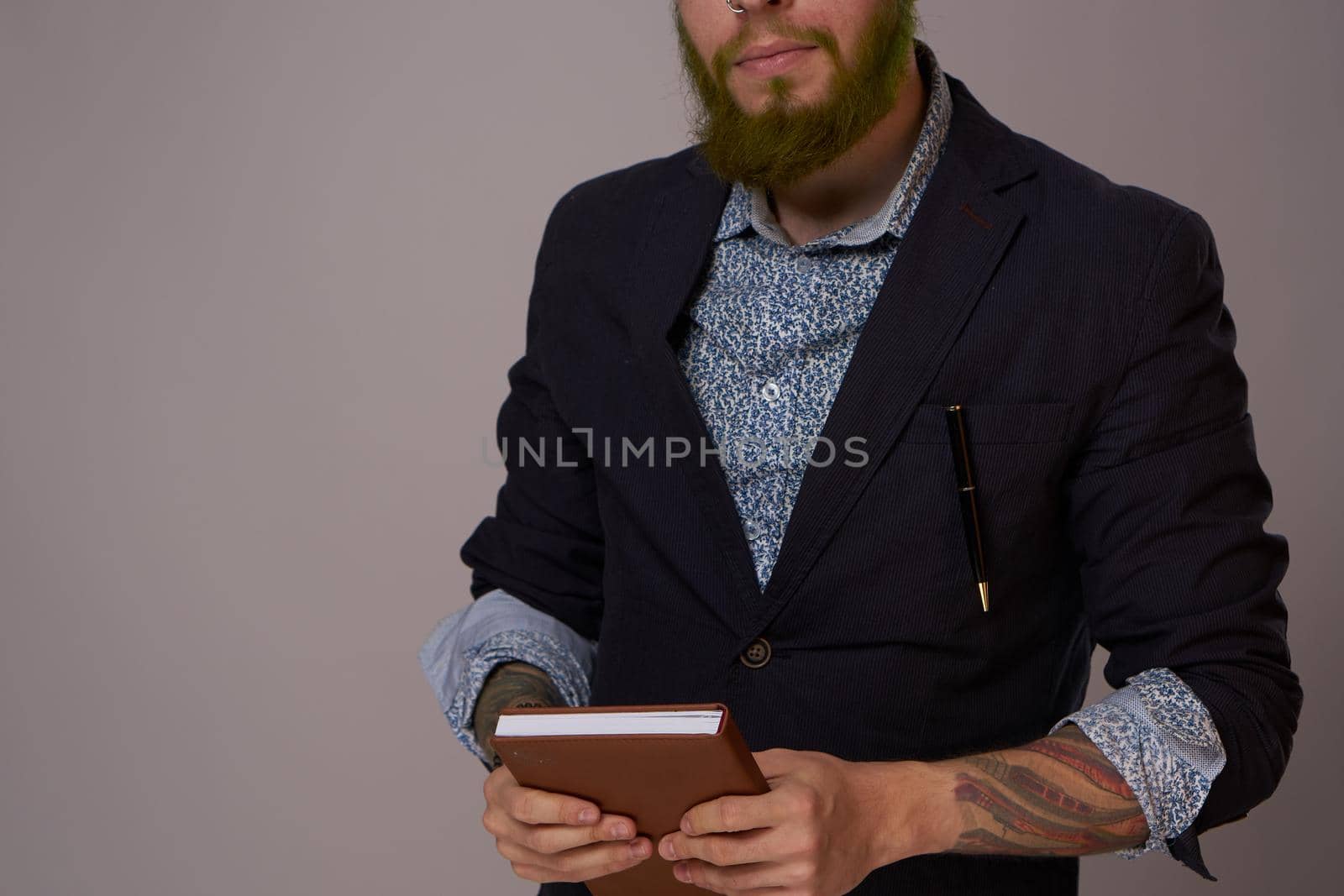 portrait of a business man wearing glasses with a beard posing an official. High quality photo