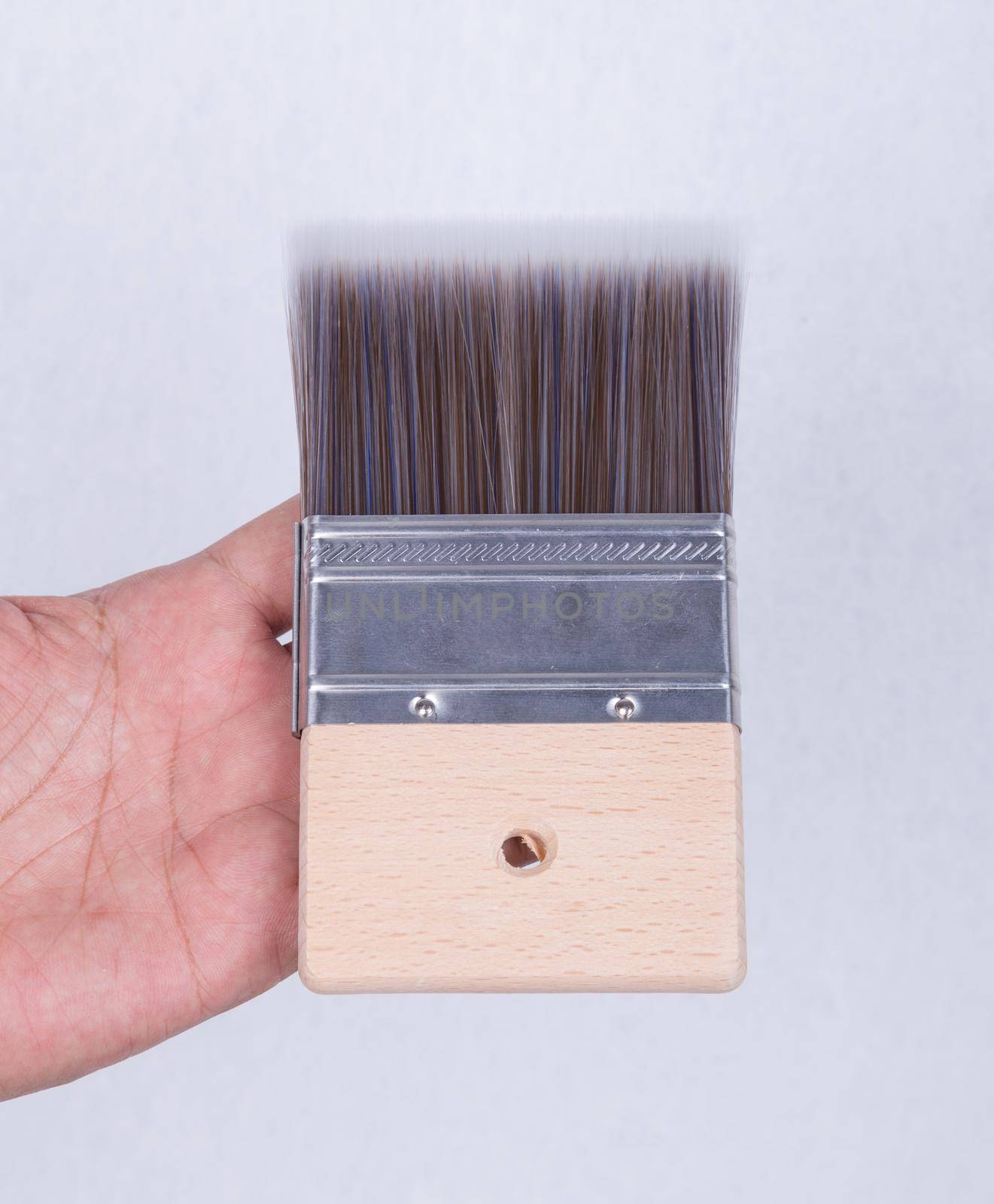 brush for color paint concrete Loft style in hand
