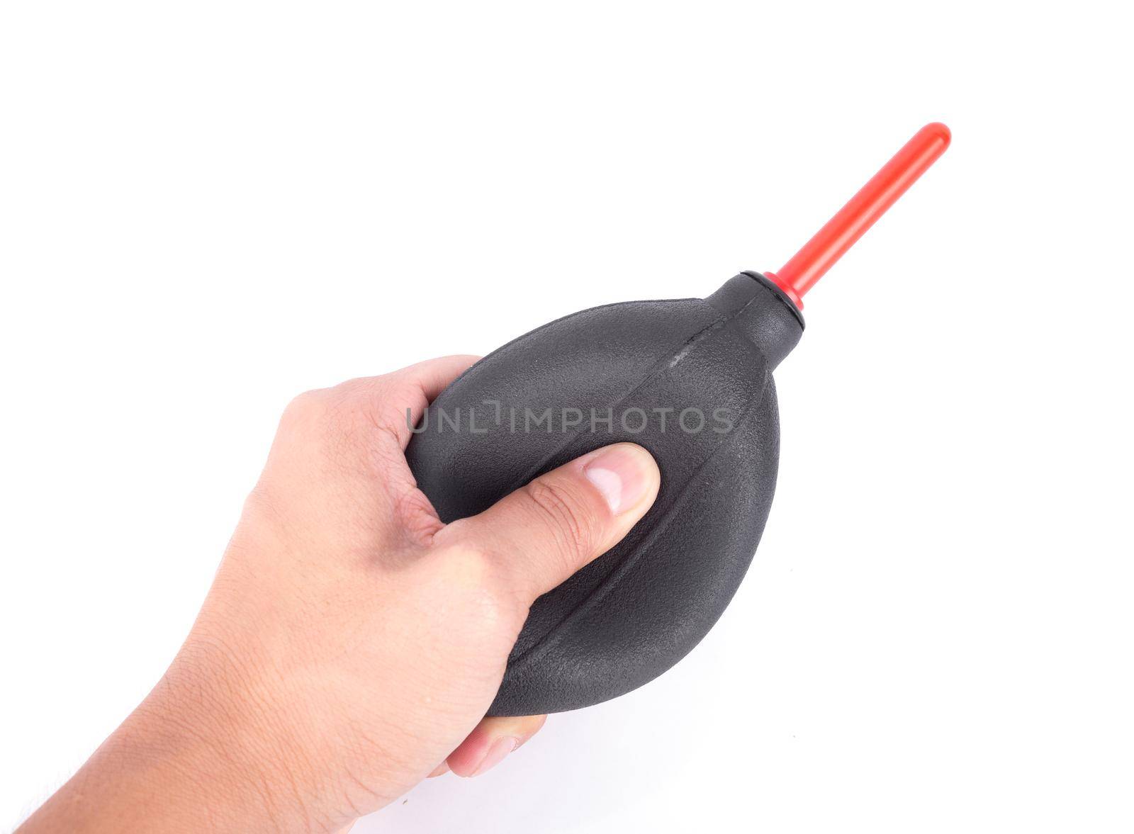 hand holding air dust blower for camera cleaning isolated on white by geargodz