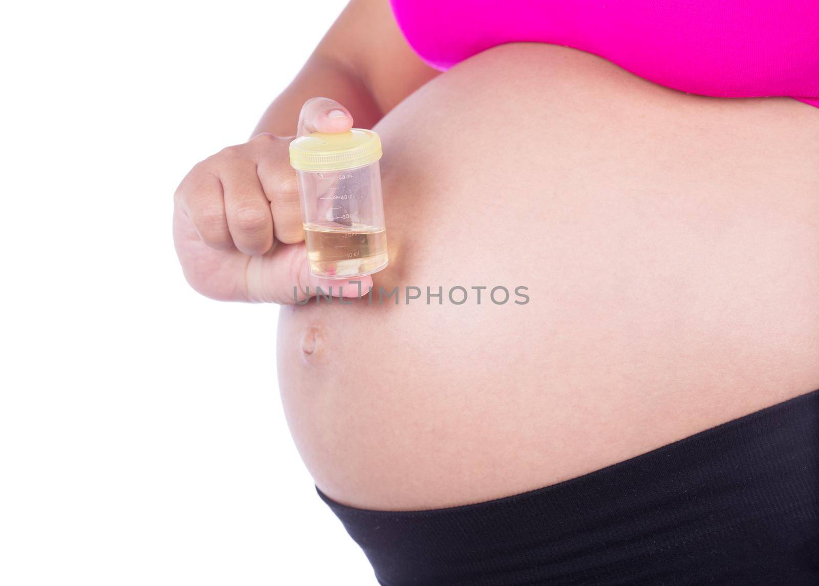 close-up belly of pregnant woman with urine bottle on white background by geargodz