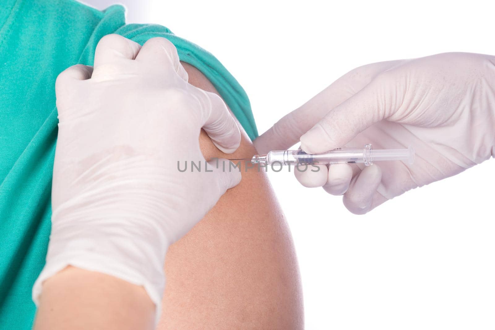 nurse with syringe giving a vaccine for a patient on white background