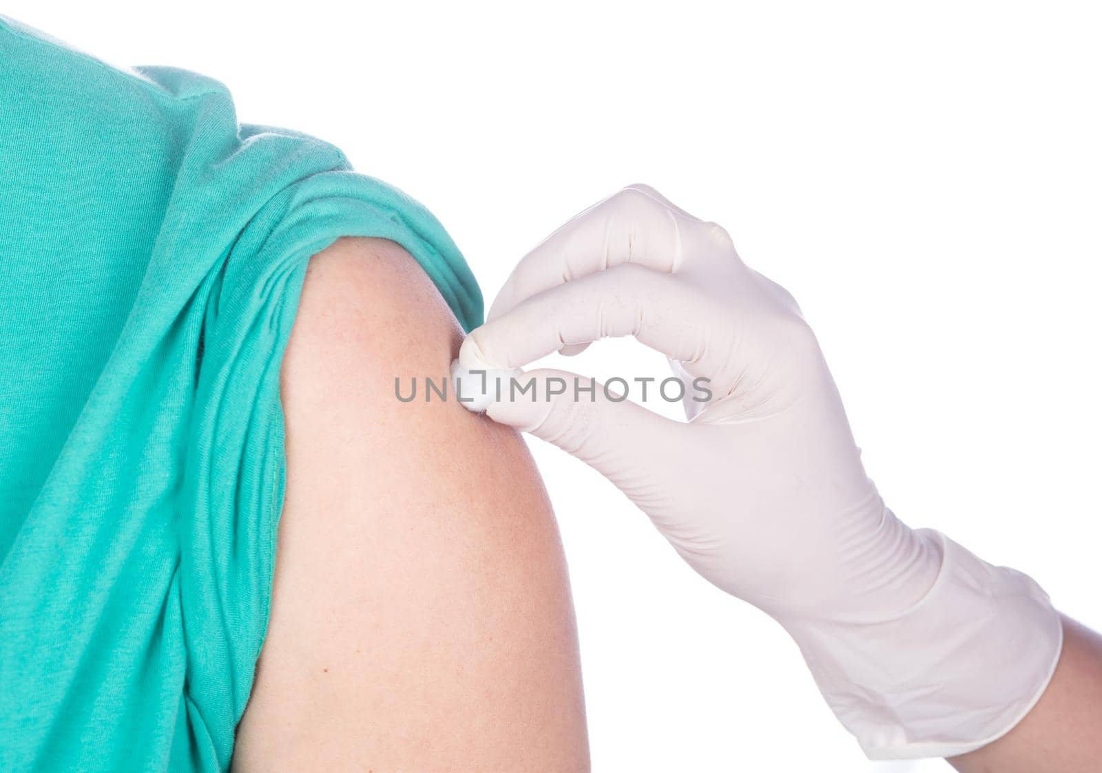 Disinfecting the arm skin by cotton before giving a vaccine isolted on white background