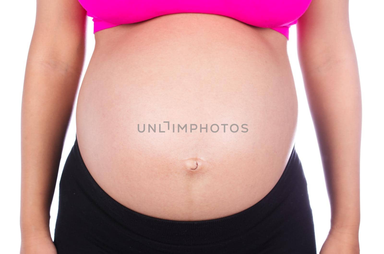 Close-up of pregnant woman belly isolated on white  by geargodz