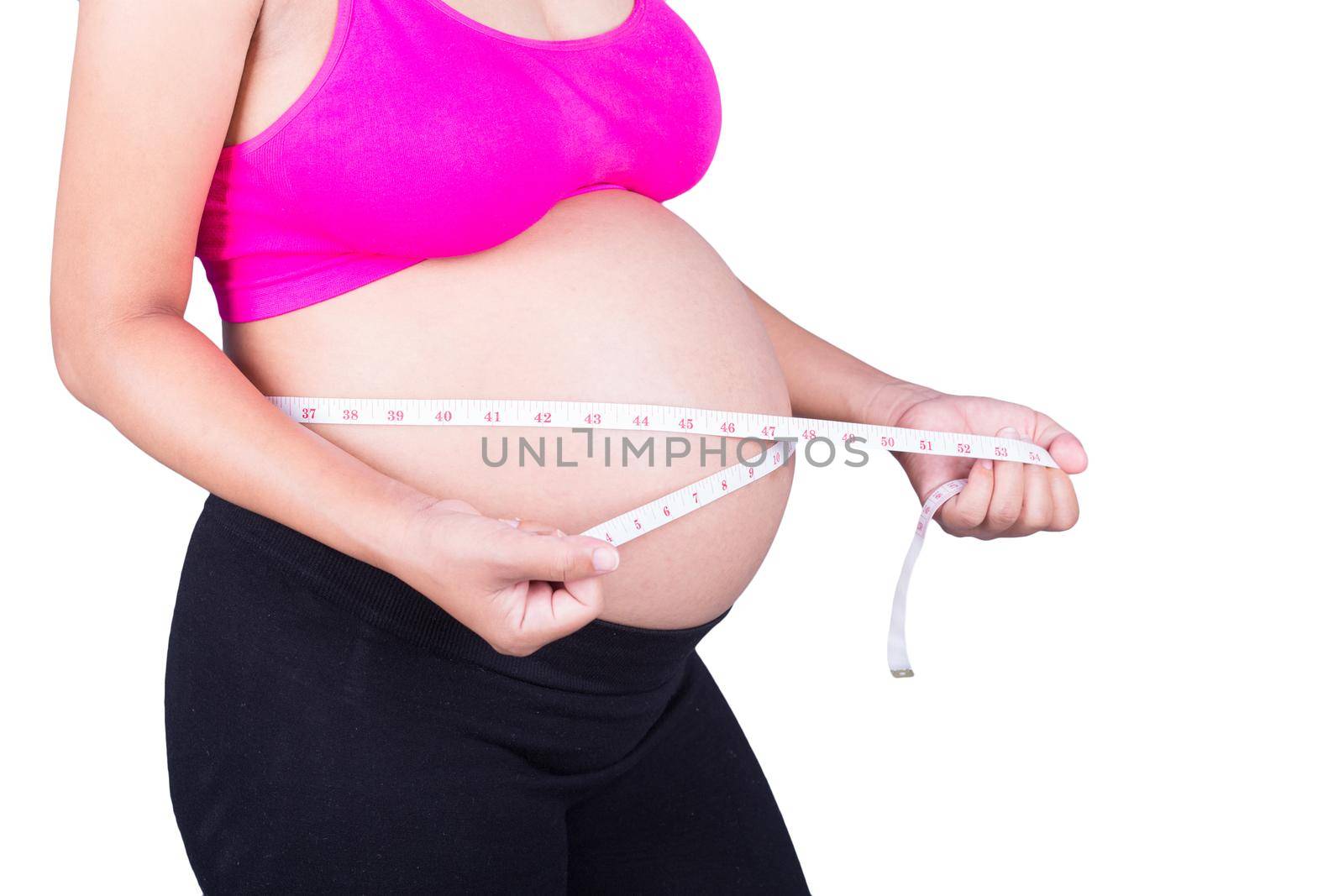 close-up belly of Pregnant woman with measuring tape isolated on white  by geargodz