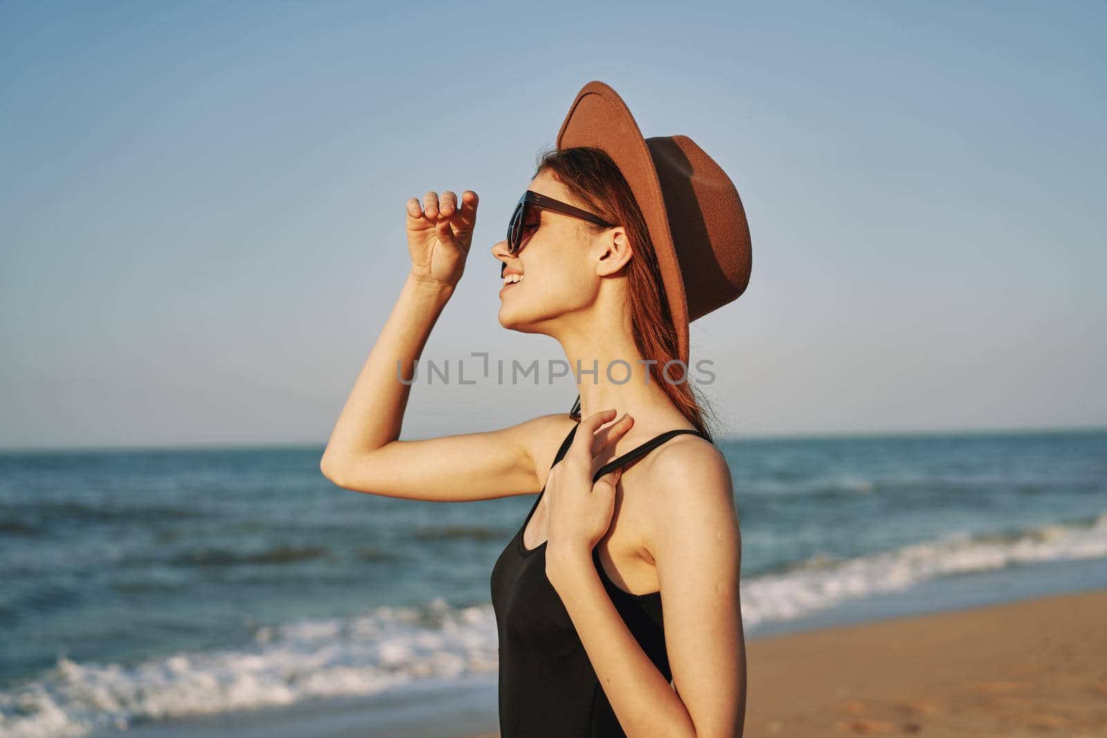 pretty woman on the beach summer vacation lifestyle sun. High quality photo