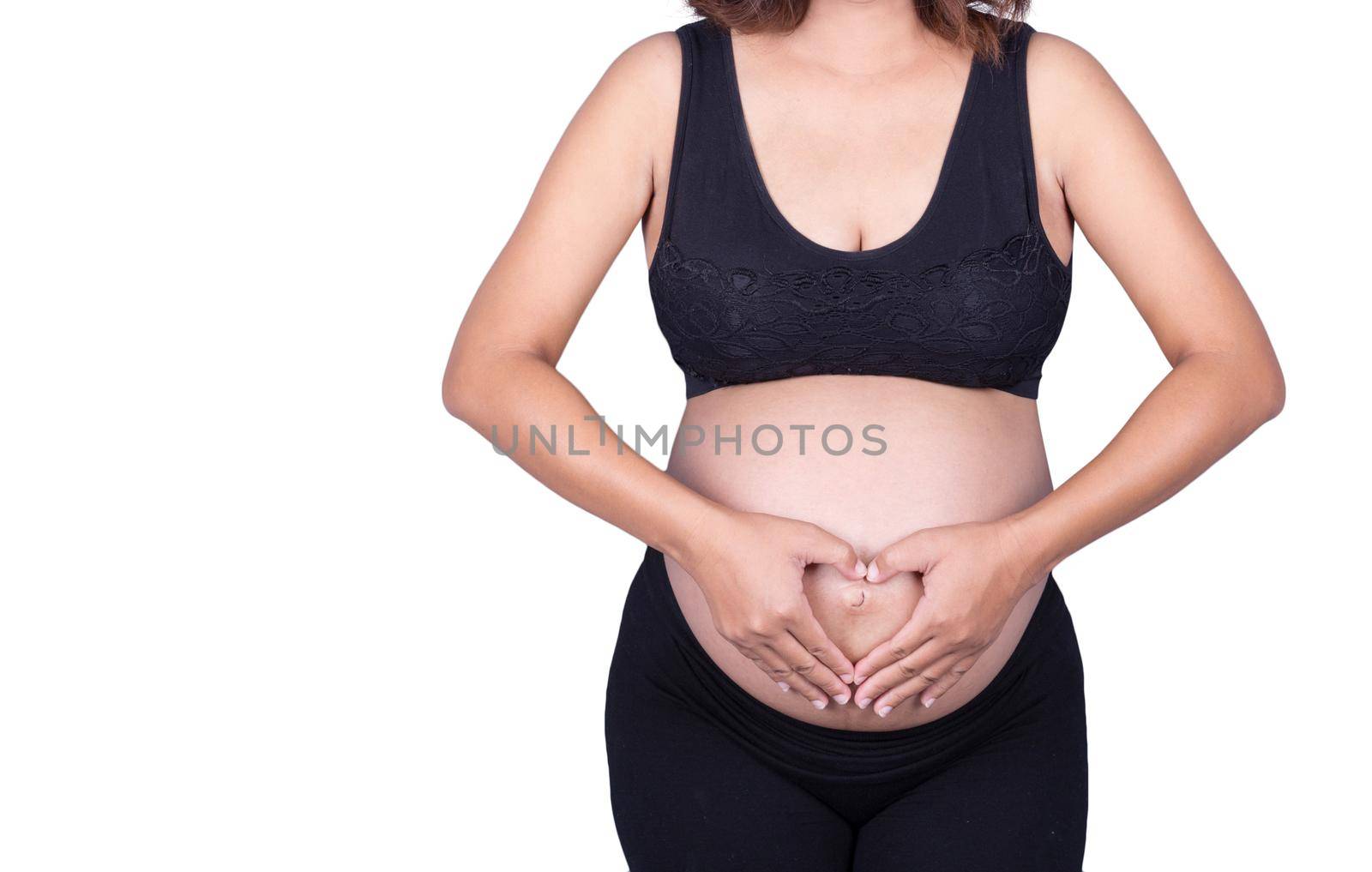 Pregnant Woman holding her hands in a heart shape on her belly isolated on white by geargodz