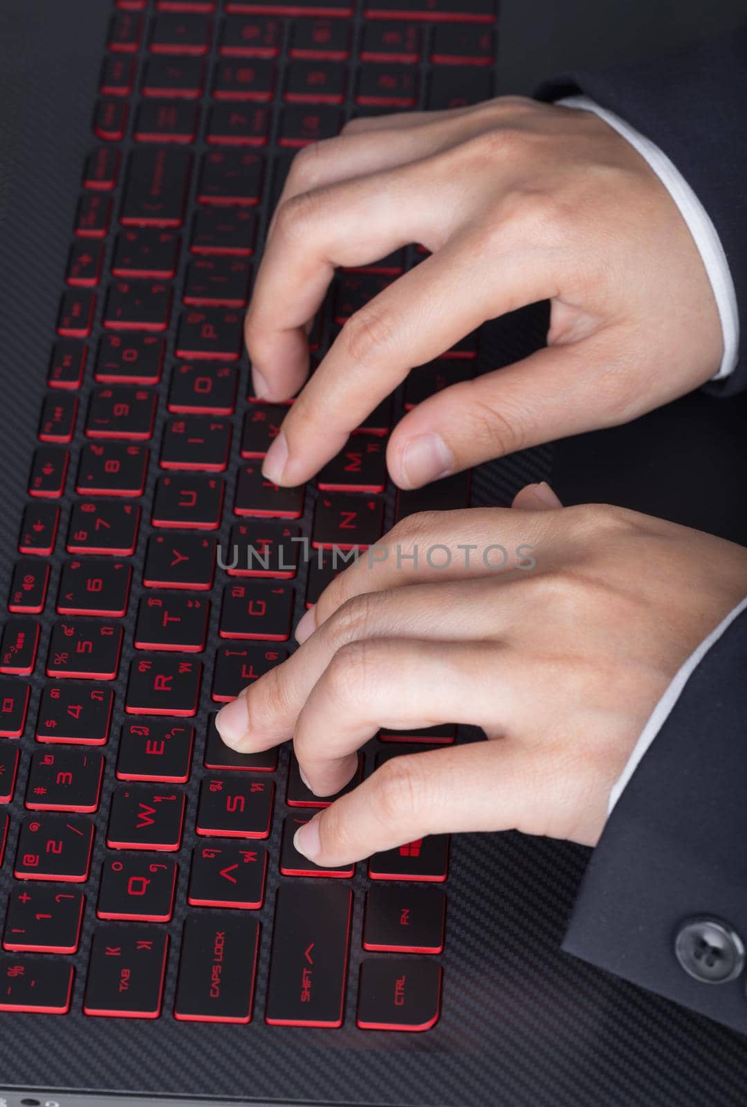 Close-up of business hand typing keyboard of laptop