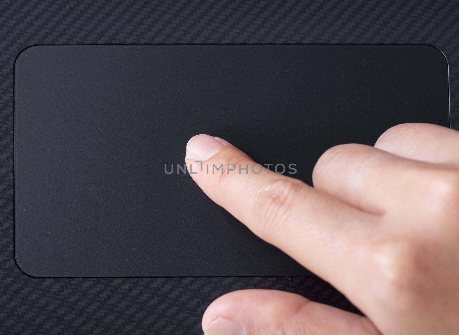 business hand working on a laptop of touchpad