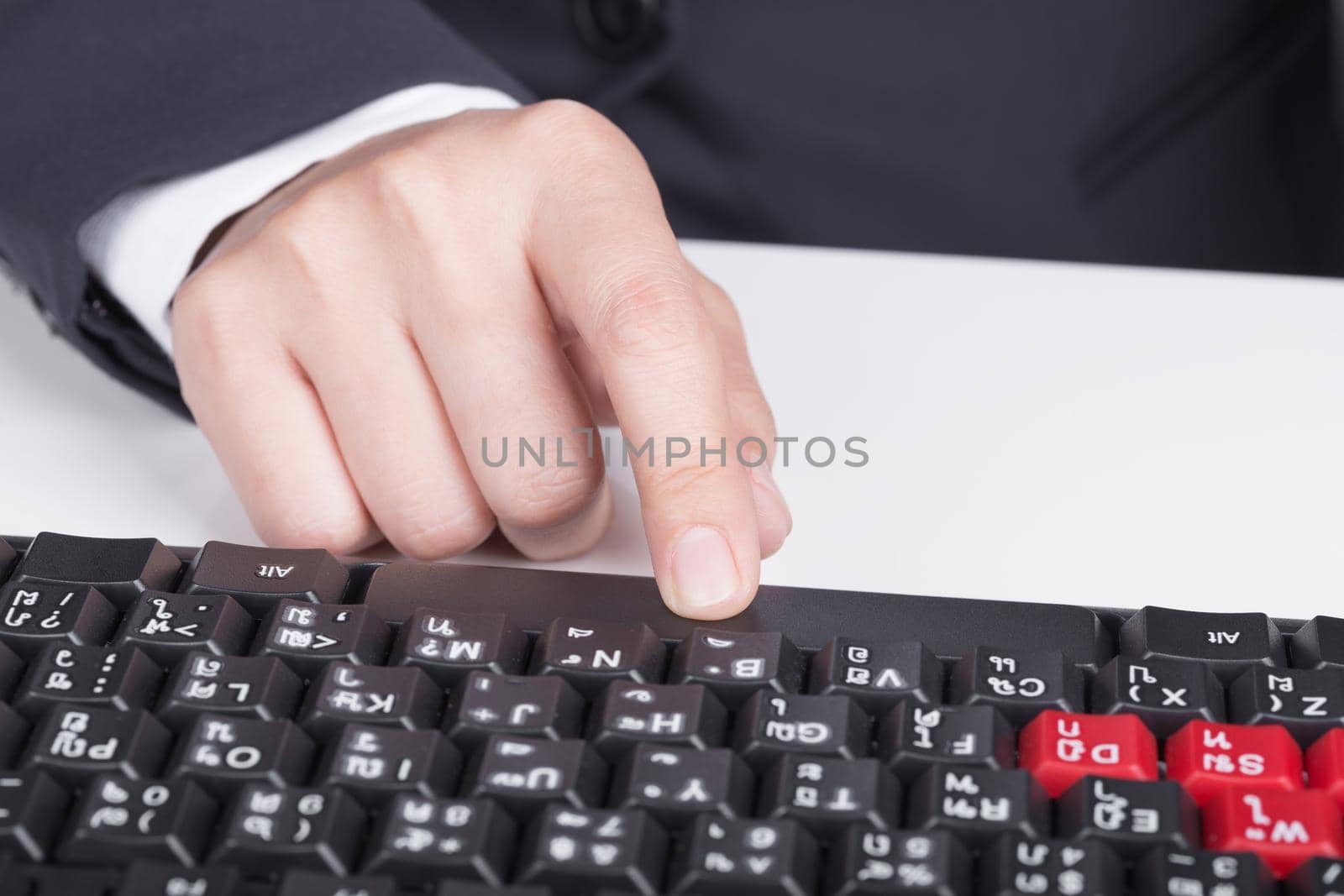 finger pushing space bar button on keyboard of computer by geargodz