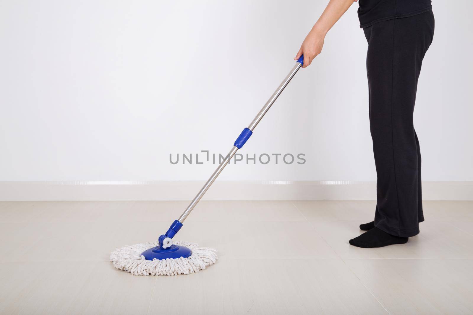 woman legs with mop cleaning floor by geargodz