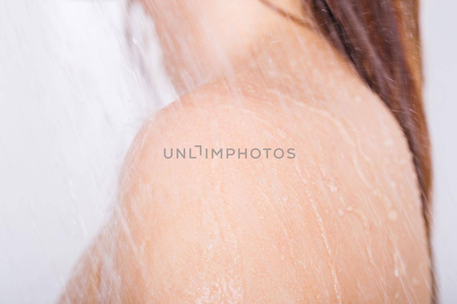 close up shoulder of woman which take a shower