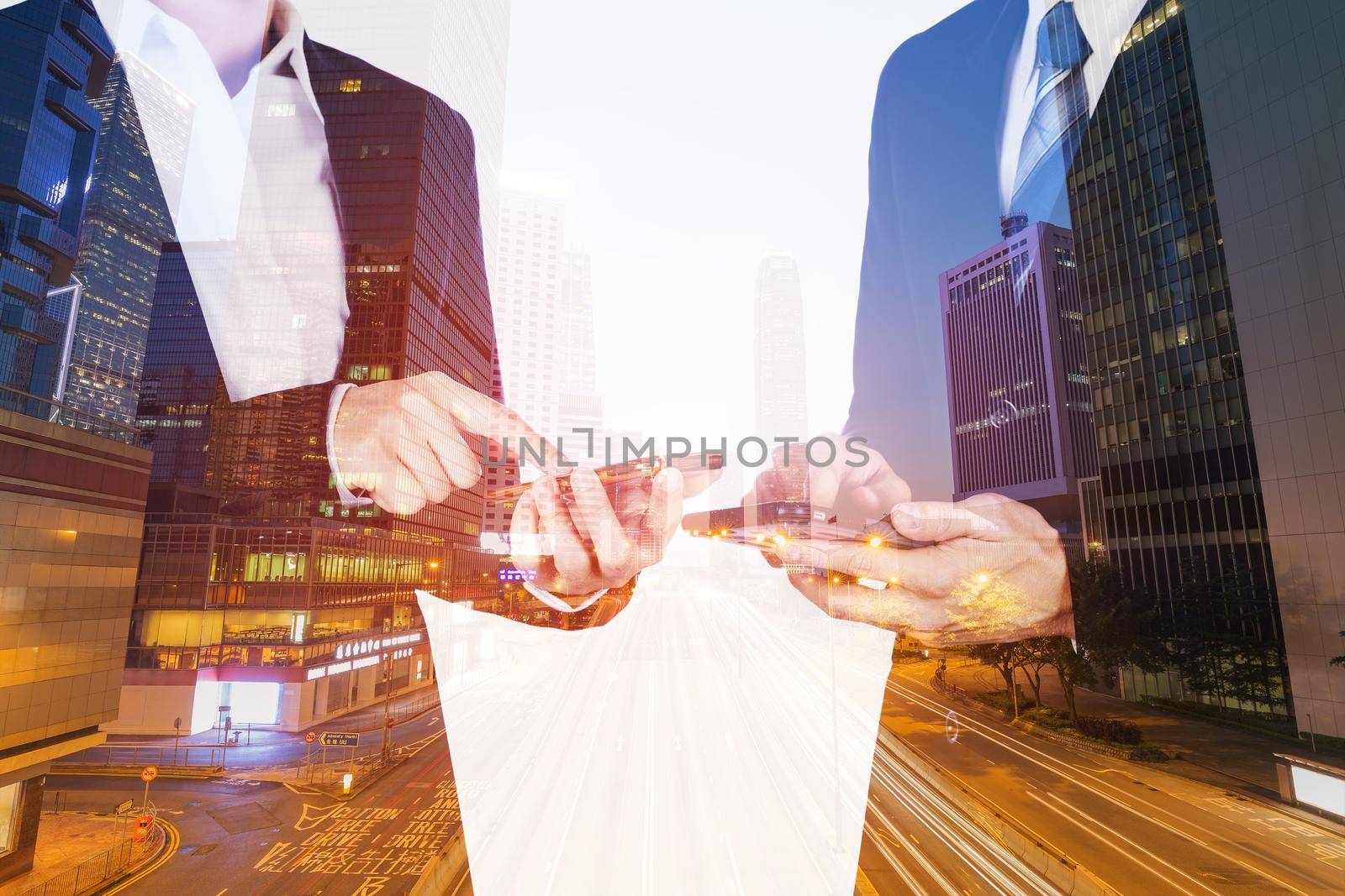 double exposure of business man and woman using smartphone with city background by geargodz