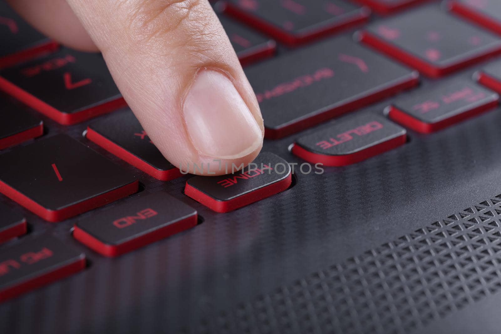 finger pushing home button on laptop keyboard by geargodz
